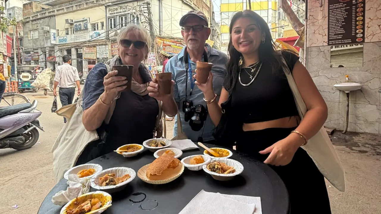 Local chef serving guests an authentic Delhi meal