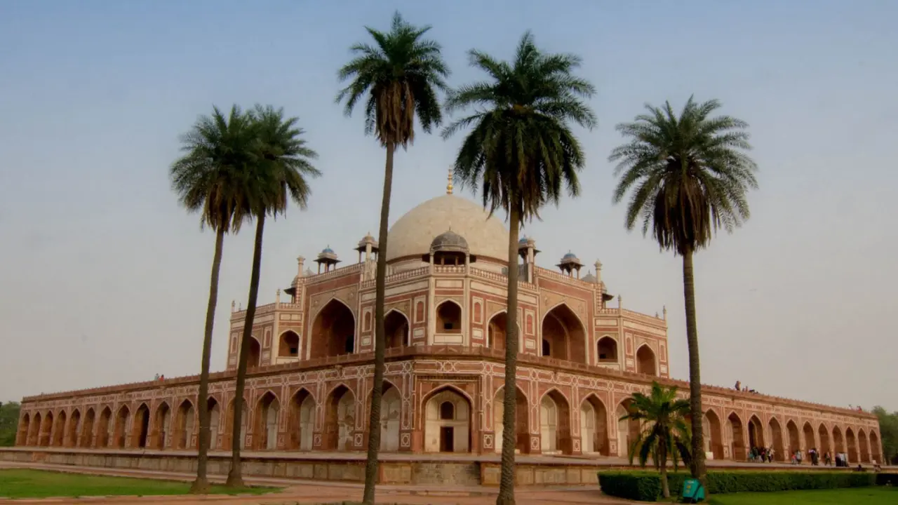 Guide leading a group on a heritage walk in Delhi